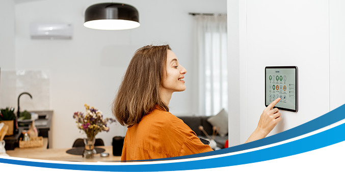 Woman accessing HVAC control panel